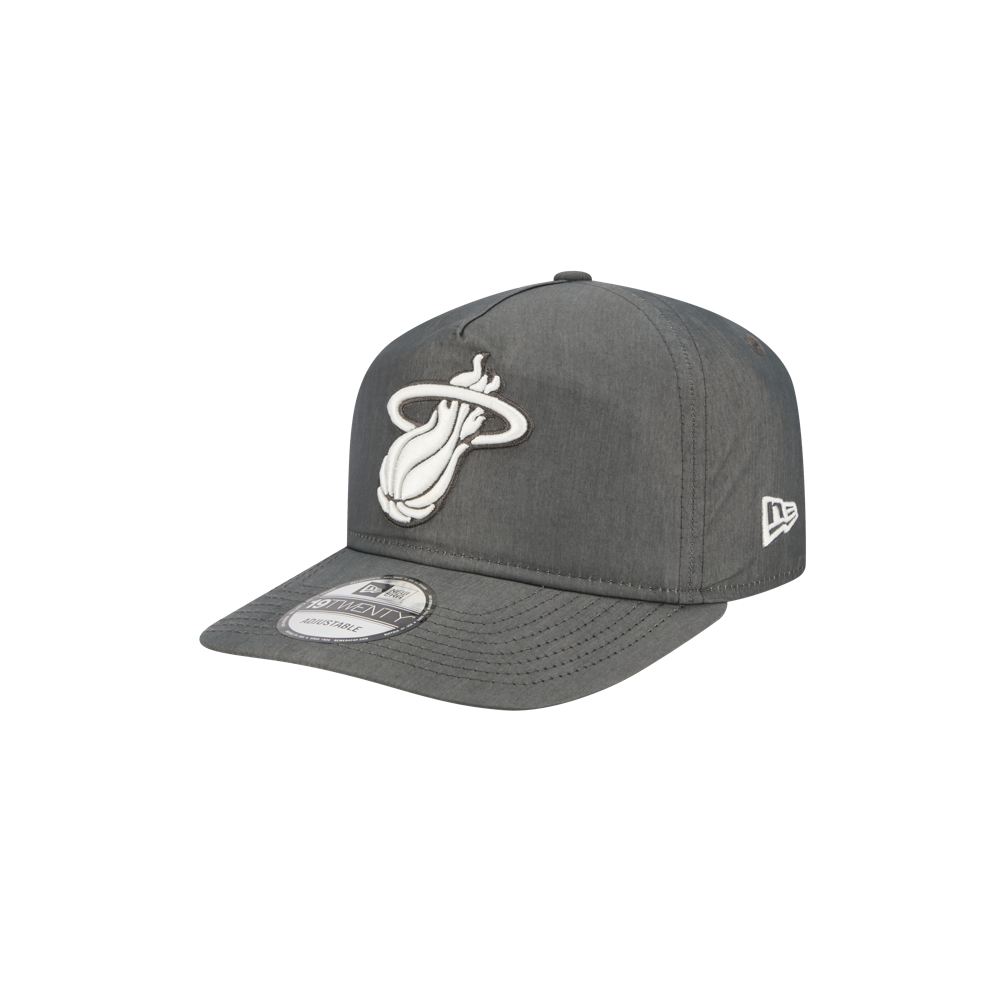 The New Era Miami HEAT Nylon Grey Snapback features the team logo in white on the front, a flat bill, side New Era branding, durable cotton nylon fabric, and an adjustable fit. Shown against a plain white background.