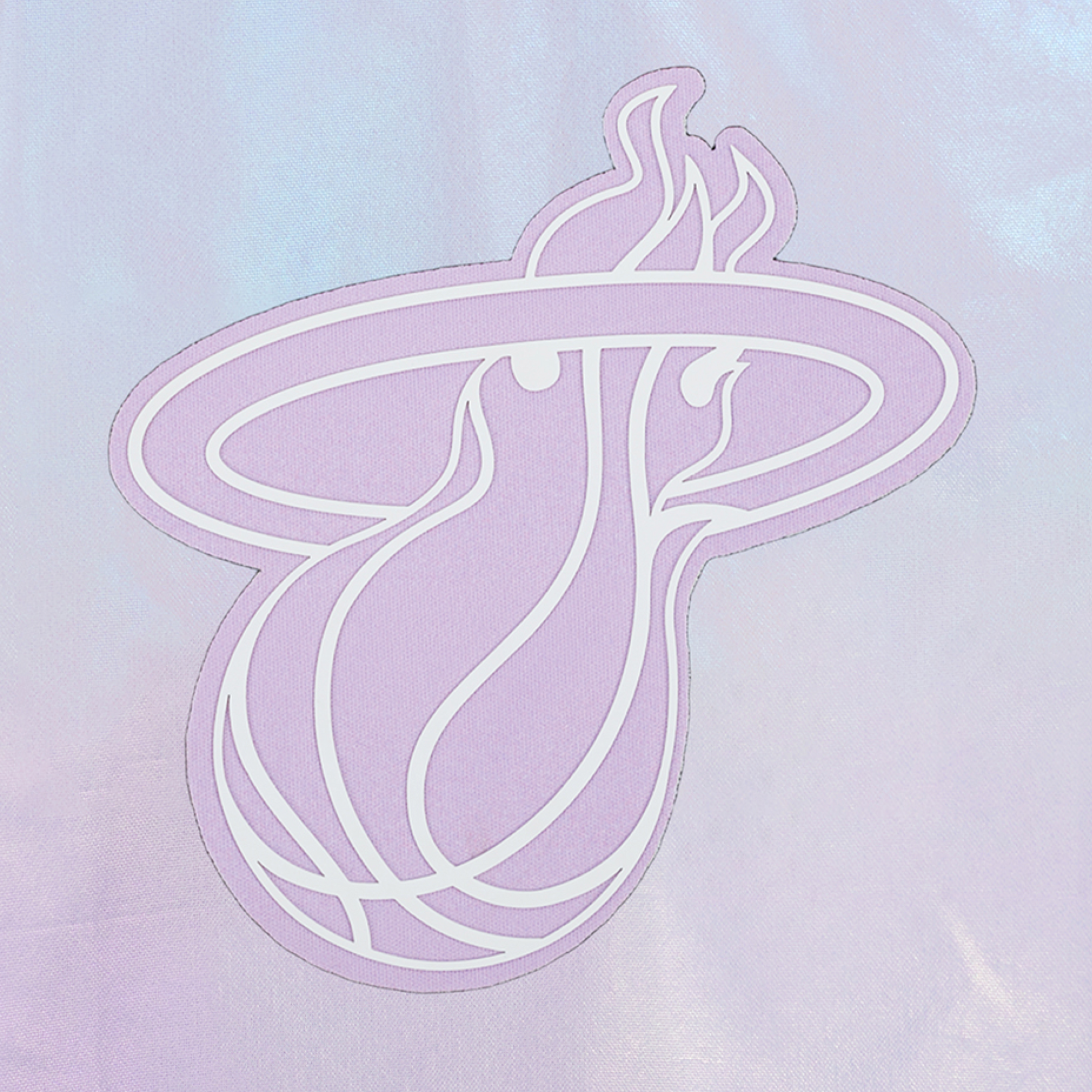 The Pro Standard Miami HEAT Hologram Half Zip Women's Hoodie features a pastel purple and white stylized flaming basketball logo, resembling the Miami Heat emblem, on a shiny light lavender polyester relaxed fit hoodie.