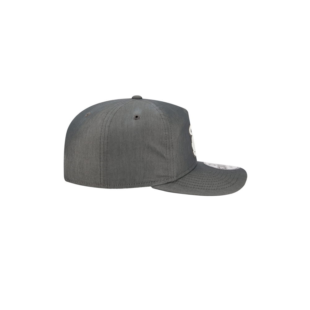 A side view of the New Era Miami HEAT Nylon Grey Snapback by New Era, featuring a pre-curved visor, visible stitching, and a cotton-nylon blend—no visible logos or designs on this side—displayed on a plain white background.