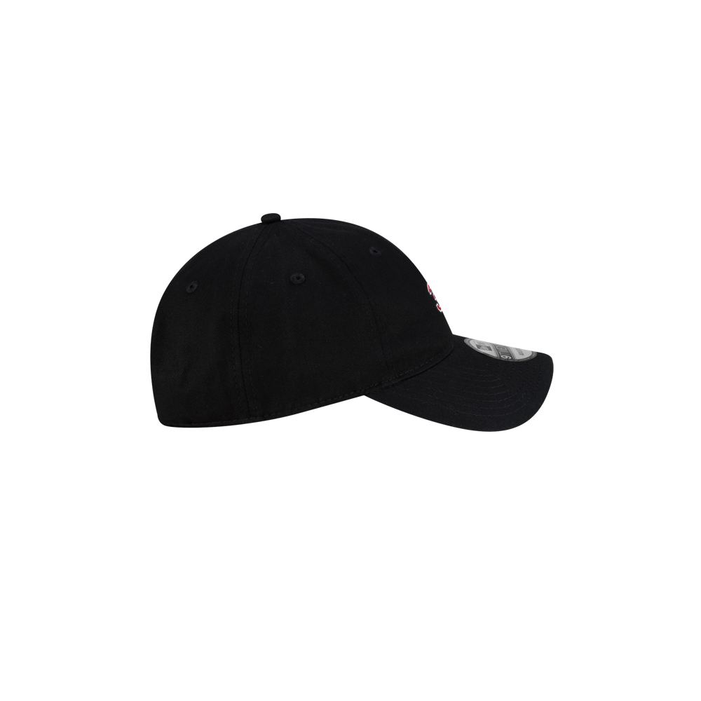 Side view of a black cotton Court Culture x New Era 305 Dad Cap with a curved brim.