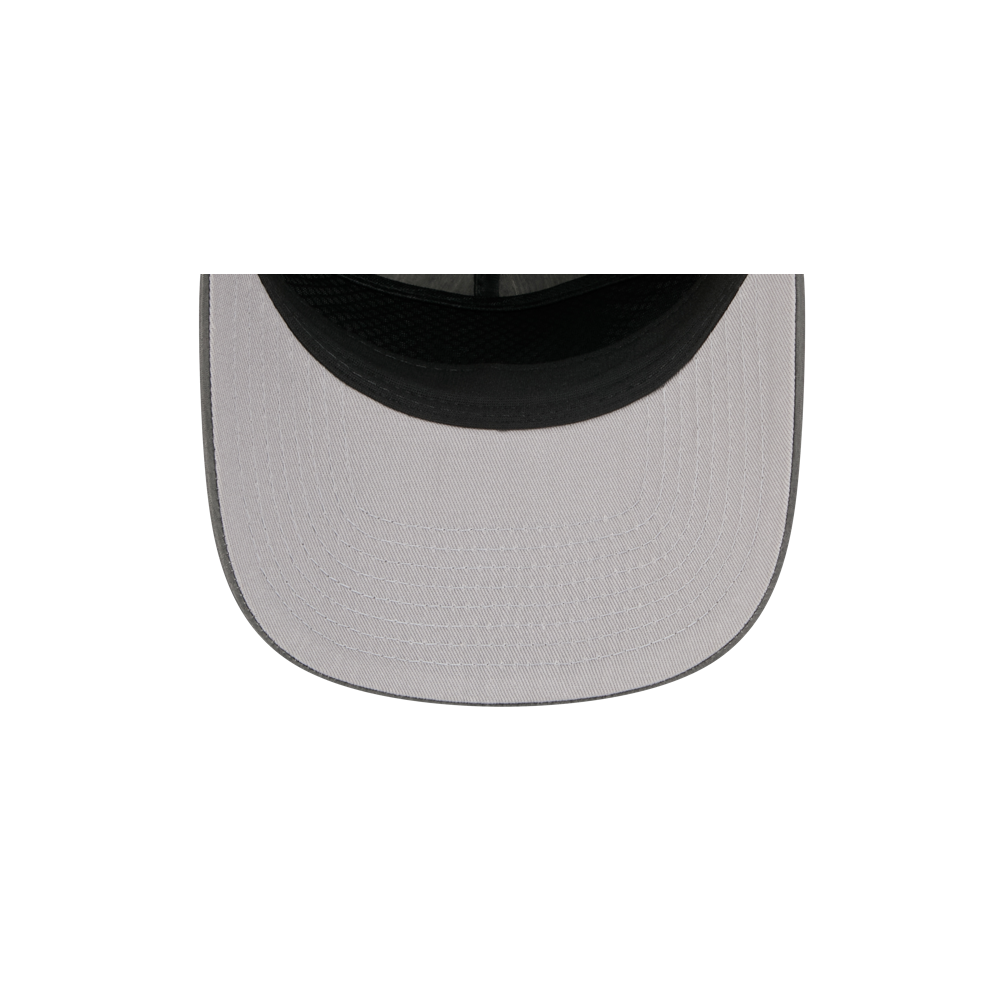 A close-up, top-down view of the New Era Miami HEAT Nylon Grey Snapback by New Era, featuring a light gray nylon design, black inner rim, pre-curved visor, and visible stitched details.