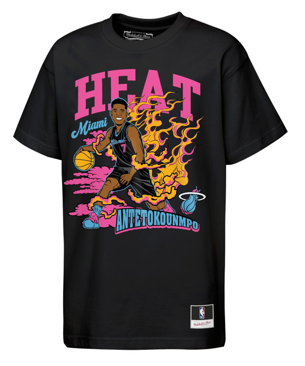 The Giannis Antetokounmpo Mitchell & Ness Miami HEAT Neon Fired Up Youth Tee by Mitchell & Ness is a black t-shirt made from 100% cotton for a comfortable, standard fit. It features a vibrant cartoon graphic of Antetokounmpo dribbling a basketball surrounded by flames, with bold, colorful “HEAT,” “Miami,” and “ANTETOKOUNMPO” text. NBA and Mitchell & Ness logos are displayed at the bottom. For best results, machine wash cold.