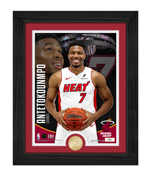 The Highland Mint Giannis Antetokounmpo Miami HEAT Bronze Coin Photo Mint features a framed photo of the basketball star wearing a Miami Heat jersey with 'Antetokounmpo' and number 7, holding a basketball. The background showcases his face, the official Miami Heat logo, and includes a gold-toned collectible coin at the bottom. This limited edition NBA memorabilia is an ideal choice for fans seeking an exclusive Giannis Antetokounmpo Miami Heat collectible or a unique addition to their collection.