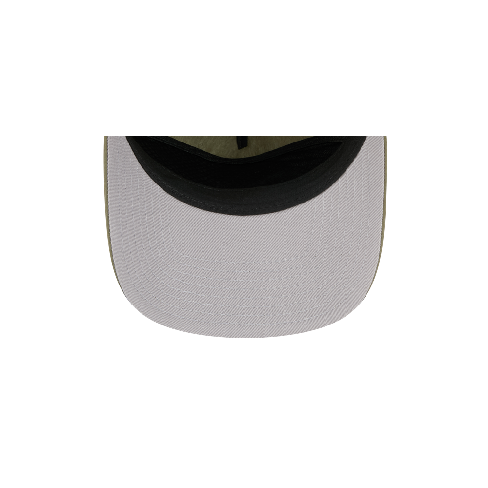 A close-up, top-down view of the brim of the New Era Miami HEAT Nylon Green Snapback hat, featuring a light gray cotton-nylon blend, black underside, and pre-curved visor, set against a plain white background.