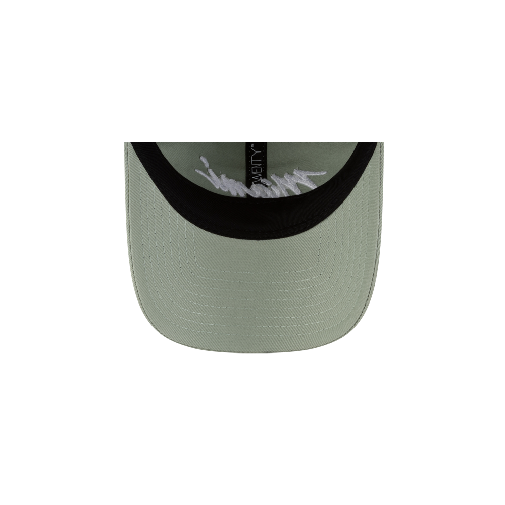 A close-up of the Court Culture Original Vice Nights Wordmark Dad Hat in green shows its curved brim and white signature inside. Made of cotton, one size fits most; spot clean only.