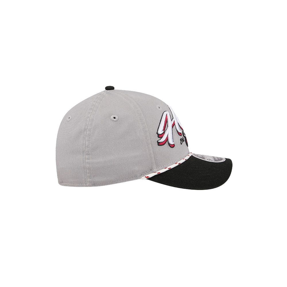The New Era Miami HEAT Loyal Team Snapback is a gray cap with a black brim and visible stitching, featuring a red, white, and black embroidered logo on the side, an A-Frame pinched front, and accent detail along the brim's edge.