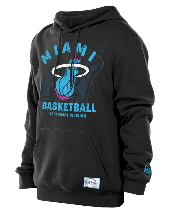 The New Era Miami HEAT Original Vice Nights Hoodie features the Miami HEAT logo and MIAMI BASKETBALL SOUTHEAST DIVISION text in blue and pink, a front pocket, left sleeve patch, and is machine washable for easy care.