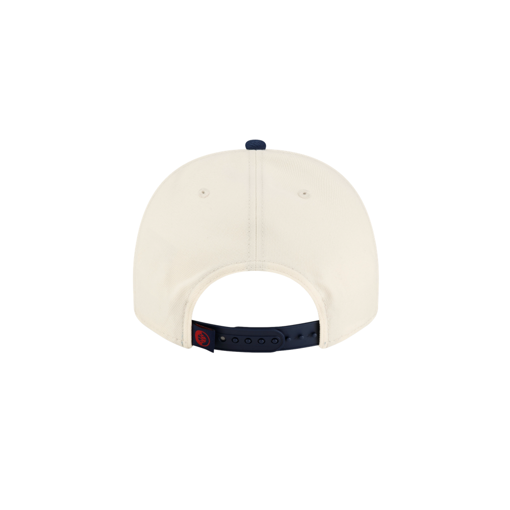 Back view of an off-white polyester Court Culture x New Era Parakeet Snapback, featuring a dark blue snapback closure and a top button.