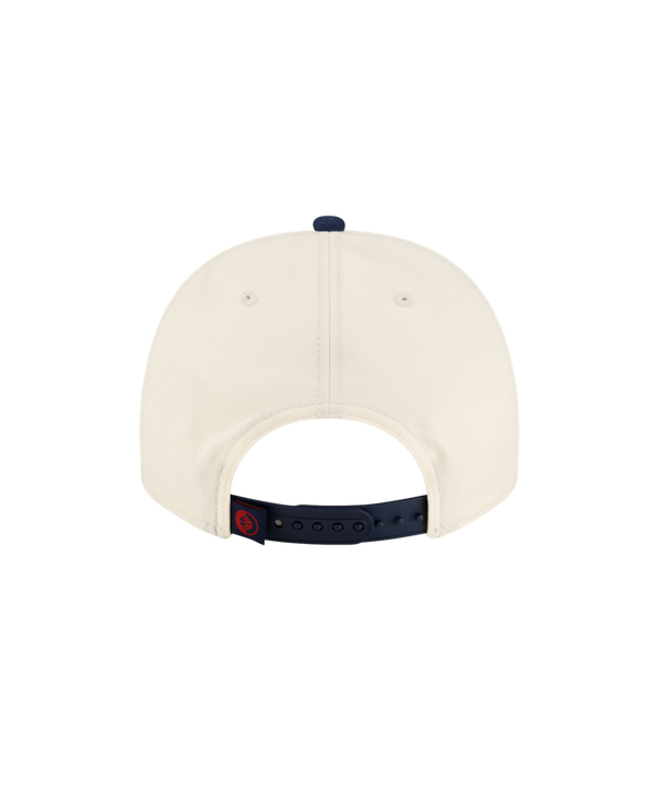 Court Culture x New Era Parakeet snapback hat in cream with a blue brim, featuring an embroidered flaming basketball logo and a green parakeet on the front panels.