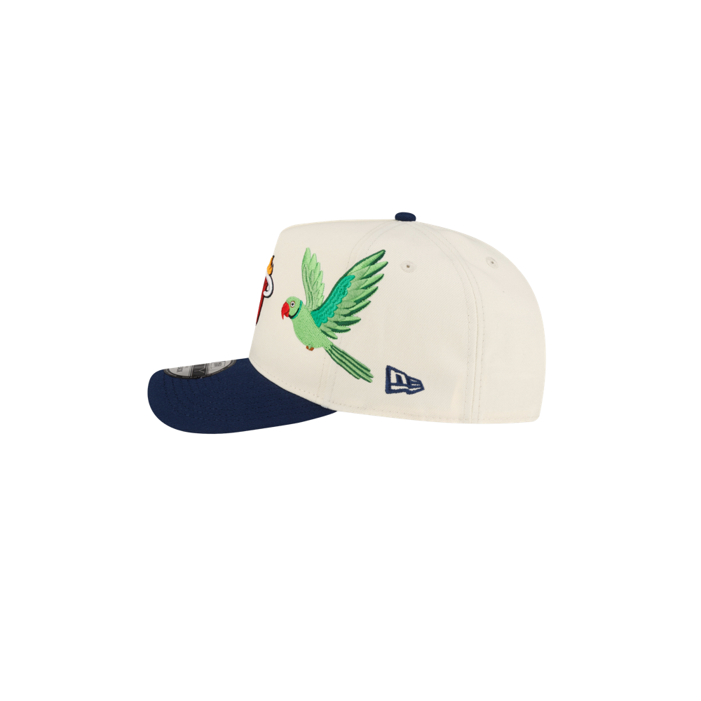 Court Culture x New Era Parakeet snapback in off-white, featuring an embroidered green parakeet and a dark blue pre-curved brim.