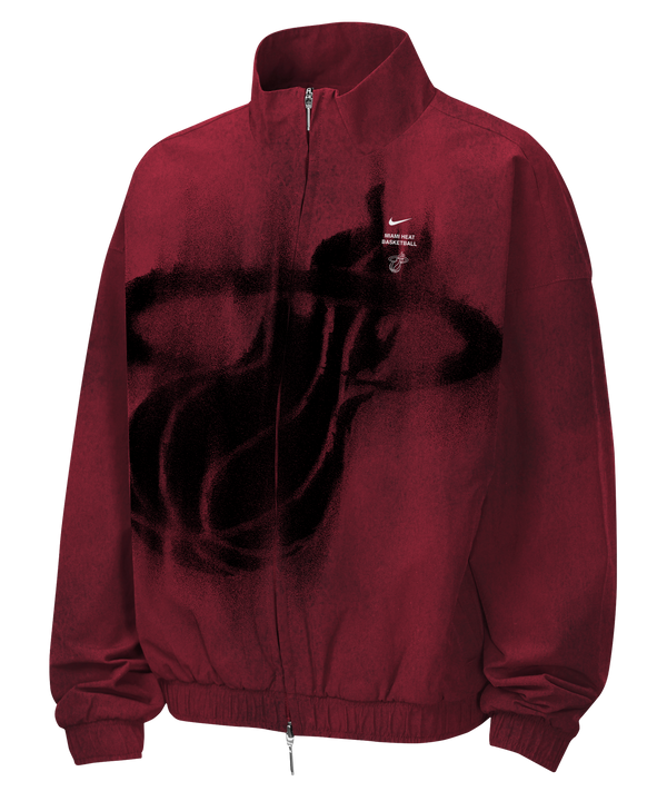 Maroon loose-fit, full-zip Nike Miami HEAT Standard Issue Loud Woven Youth Jacket featuring a large black spray-paint style basketball graphic on the front, with a small team logo and text on the upper chest.
