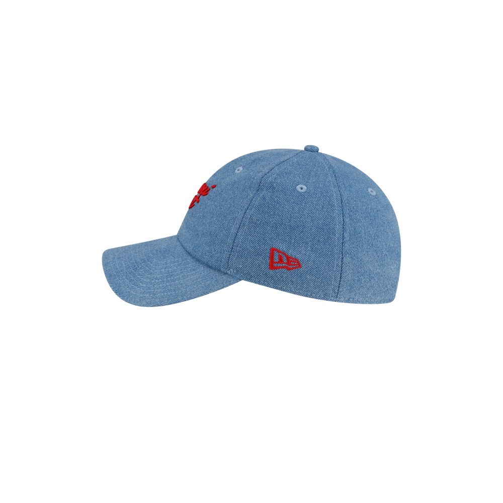 Court Culture x New Era Retro Denim Dad Hat in blue denim with red embroidered lettering on the front, a small red logo on the side, and a one-size-fits-most cotton construction.