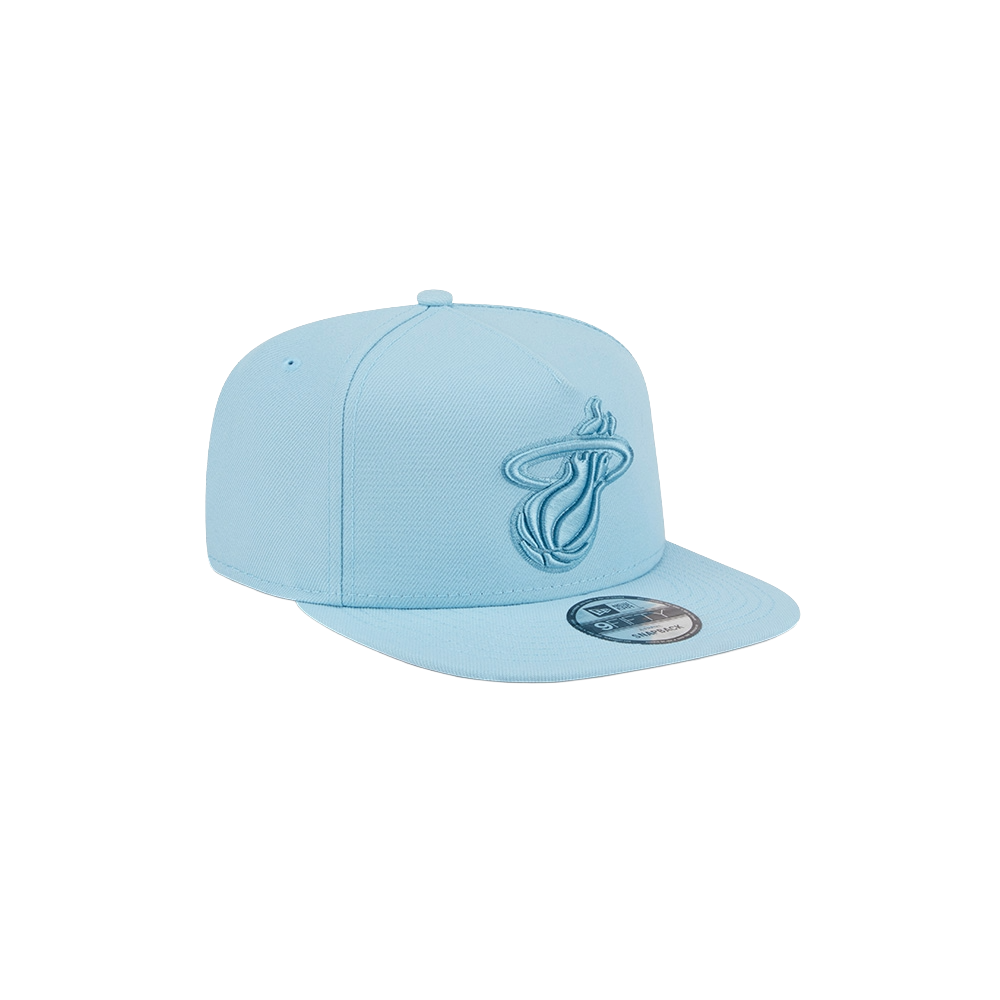The New Era Miami HEAT Light Blue Color Pack Snapback features a light blue polyester A-frame design, flat brim, embroidered team logo on the front, and New Era sticker; one size fits most. Displayed on a plain white background.