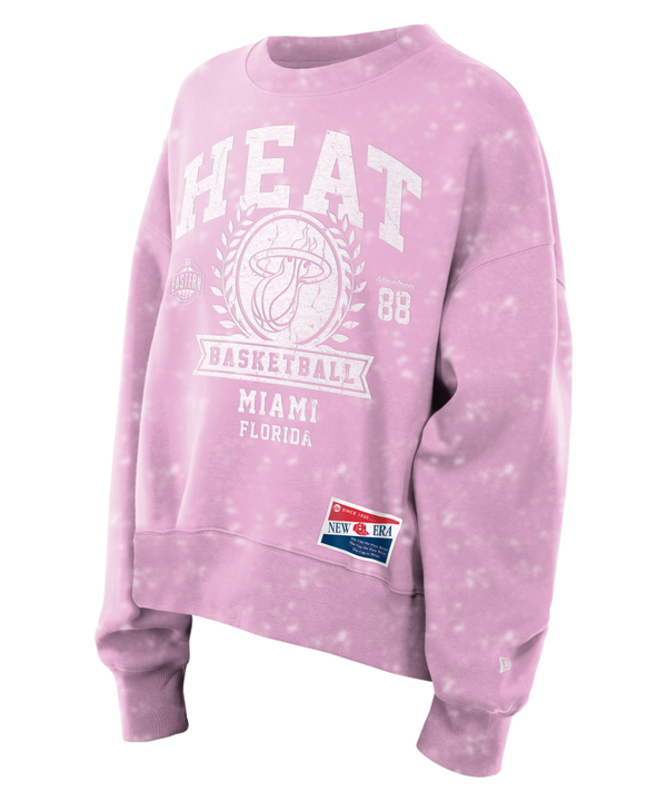 The New Era Miami HEAT Women's Pink Basketball Crewneck features white HEAT, Basketball, Miami Florida text, and the number 88. Made from a soft cotton-polyester blend with a relaxed fit and New Era tag. Machine wash cold for best care.