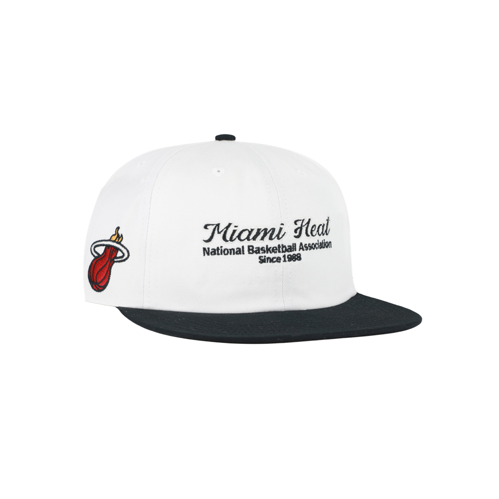 The ’47 Brand Miami HEAT Script Snapback is a white cotton baseball cap with a black brim, featuring the Miami Heat logo and the embroidered text “Miami Heat National Basketball Association Since 1988” on the front. Designed for comfort, this classic hat offers a one-size-fits-most fit—perfect for any fan.