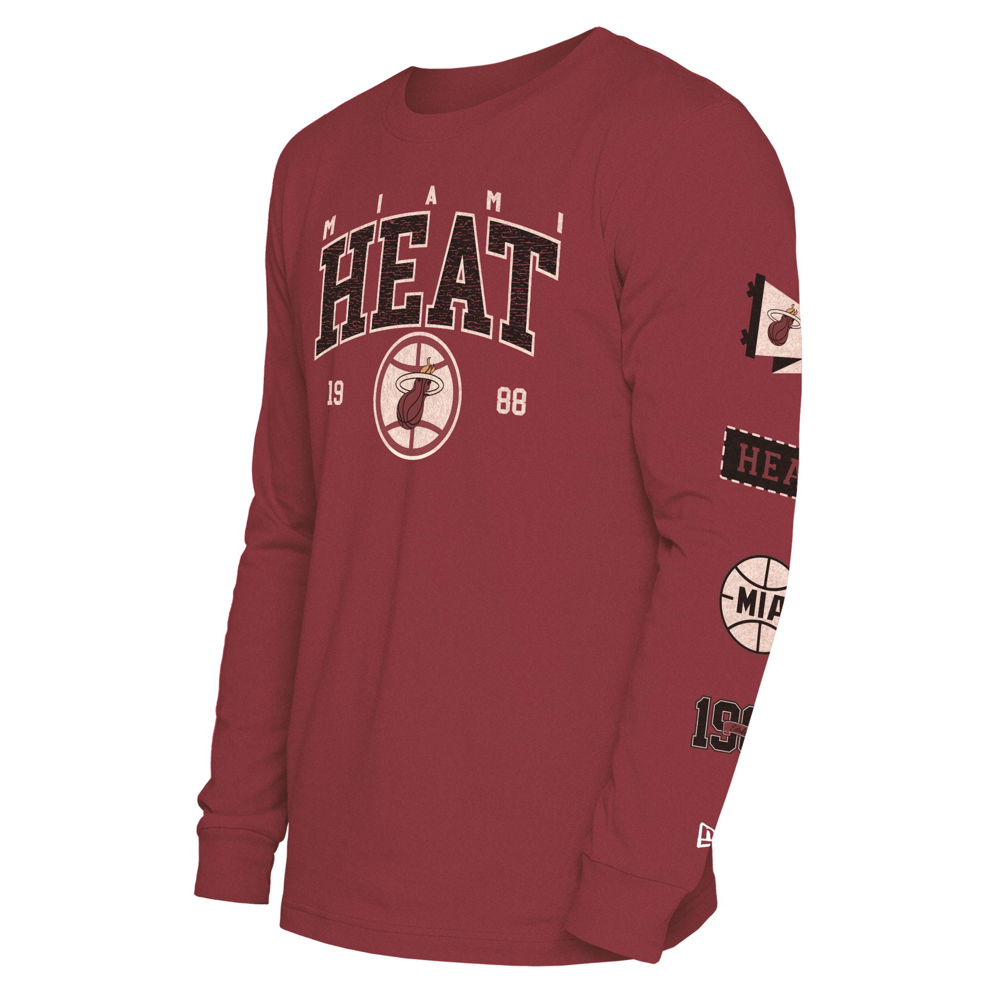 The New Era Miami HEAT Red Cuffed Long Sleeve Tee features the team name, logo, and 1988 on the front, plus Miami Heat patches on the left sleeve. Made from soft cotton-polyester in a standard fit. Machine wash cold.