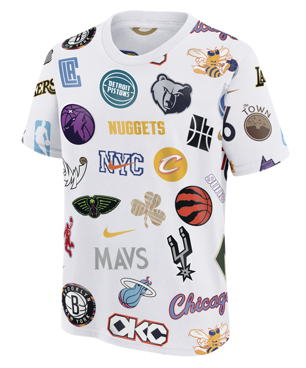 The Nike NBA Allover Original Vice Nights Logo Youth Tee by Nike is a white cotton t-shirt with colorful NBA team logos across the front. This machine-washable tee offers a standard fit for everyday comfort and style.