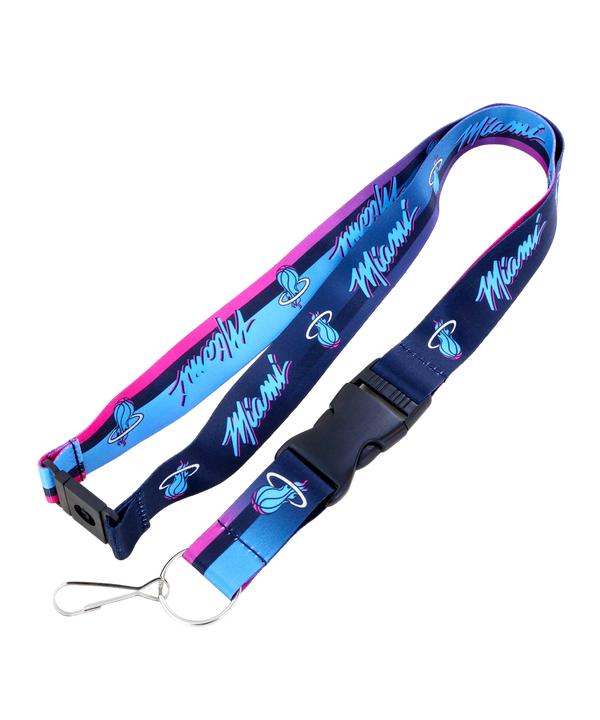 The Aminco Miami HEAT Original Vice Nights Fade Lanyard is an officially licensed blue and pink accessory featuring the team logo and “Miami” text, with a black buckle, metal clip, and split key ring.
