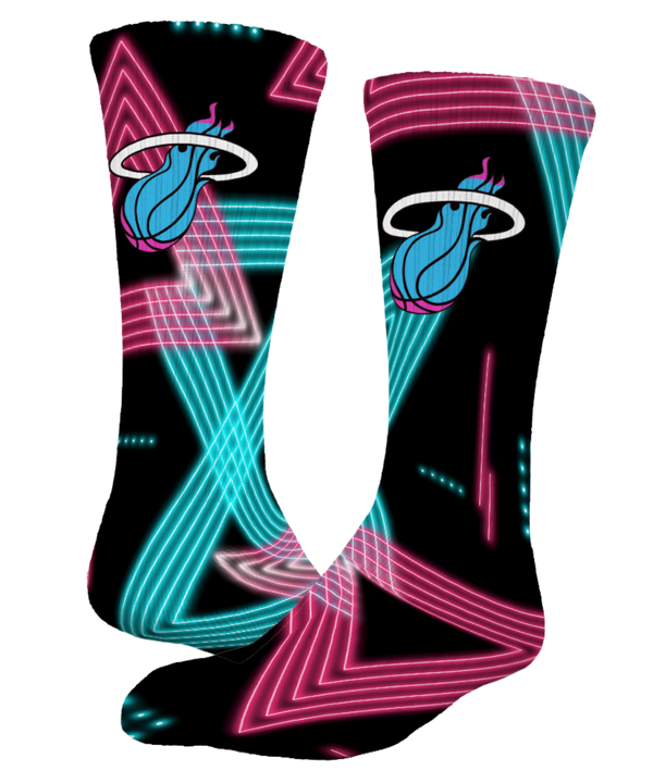 Elevate your style with Miami HEAT Original Vice Nights Laser Socks by ISlide, featuring retro neon blue and pink 1980s designs and team logo on black. These moisture-wicking socks keep you cool while showing off classic flair.