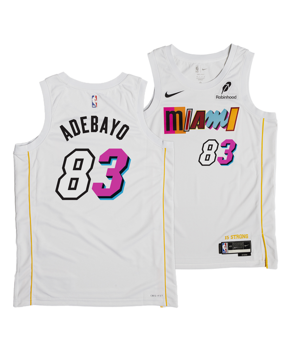 The Nike Bam Adebayo Miami Mashup Vol. 2 “83-Point Game” Swingman Jersey features a white design, colorful Miami text, black and pink 83 number, Adebayo 83 on the back with pink/blue shadows, Dri-FIT fabric, and sponsor logos.