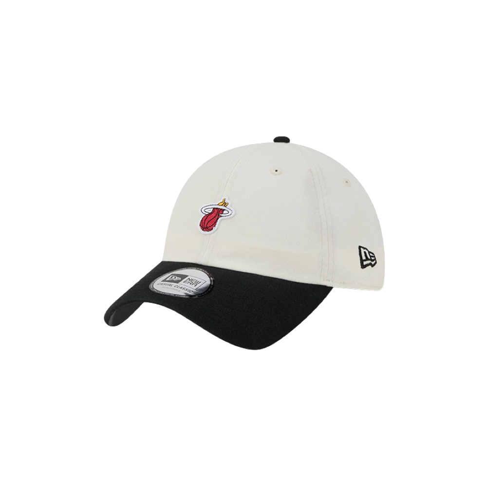 The New Era Miami HEAT 2-Tone Micro Dad Hat is a white and black cotton cap featuring the Miami Heat logo on the front and the New Era logo on the side, displayed against a white background. Designed for casual wear, this one-size-fits-most hat ensures comfortable everyday use.