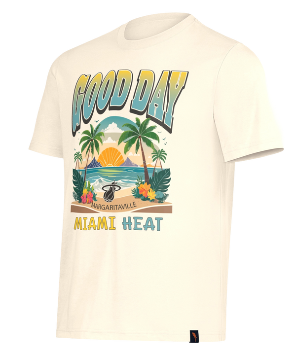 The G-III Sports Margaritaville Miami HEAT Good Day Tee is a cream, standard-fit shirt with a tropical palm tree, sunset, and ocean design. Made from soft cotton-polyester and machine washable. Features 