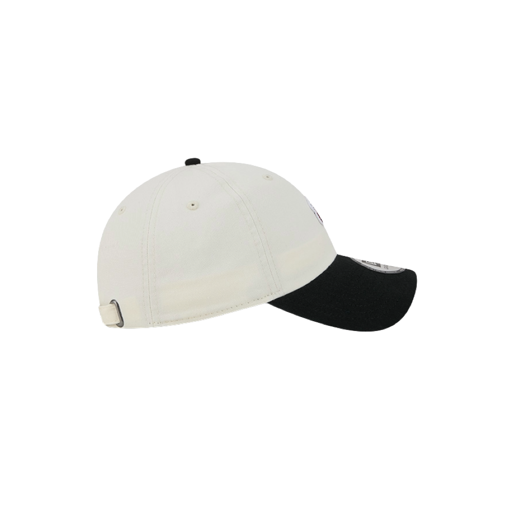 The New Era Miami HEAT 2-Tone Micro Dad Hat by New Era features a casual design with a white crown and black curved brim. Crafted from cotton, this hat is shown from the side against a plain white background. Designed as one size fits most, it delivers both comfort and classic style.