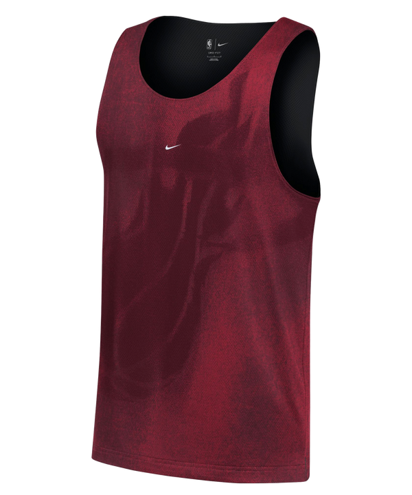The Nike Miami HEAT Standard Issue Red Mesh Jersey is a sleeveless athletic tank top in maroon, crafted from breathable mesh and featuring a subtle Miami Heat logo along with a small embroidered Nike Swoosh on the chest, shown against a white background.