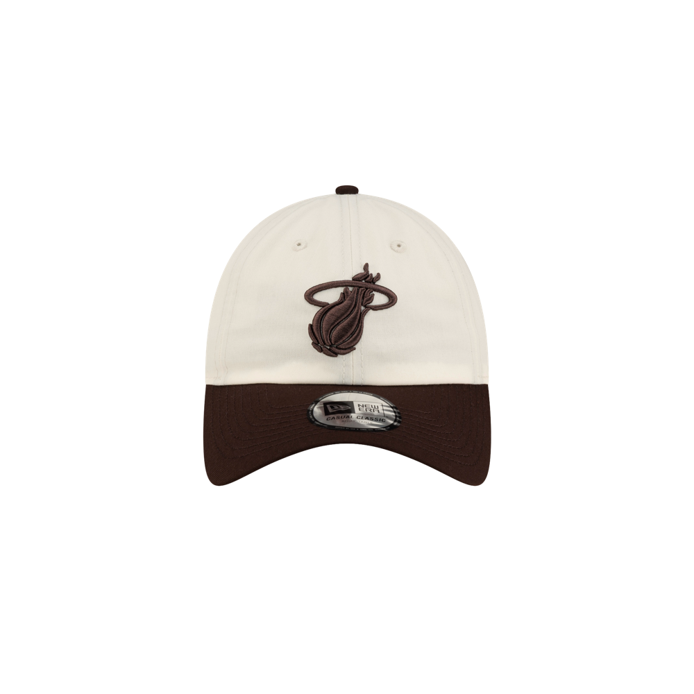 Off-white polyester Court Culture x New Era Café y Leche Dad Cap with a dark brown visor and a brown Miami Heat logo embroidered on the front, in a one size fits most design.