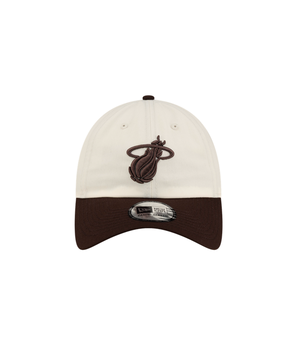 Off-white polyester Court Culture x New Era Café y Leche Dad Cap with a dark brown visor and a brown Miami Heat logo embroidered on the front, in a one size fits most design.