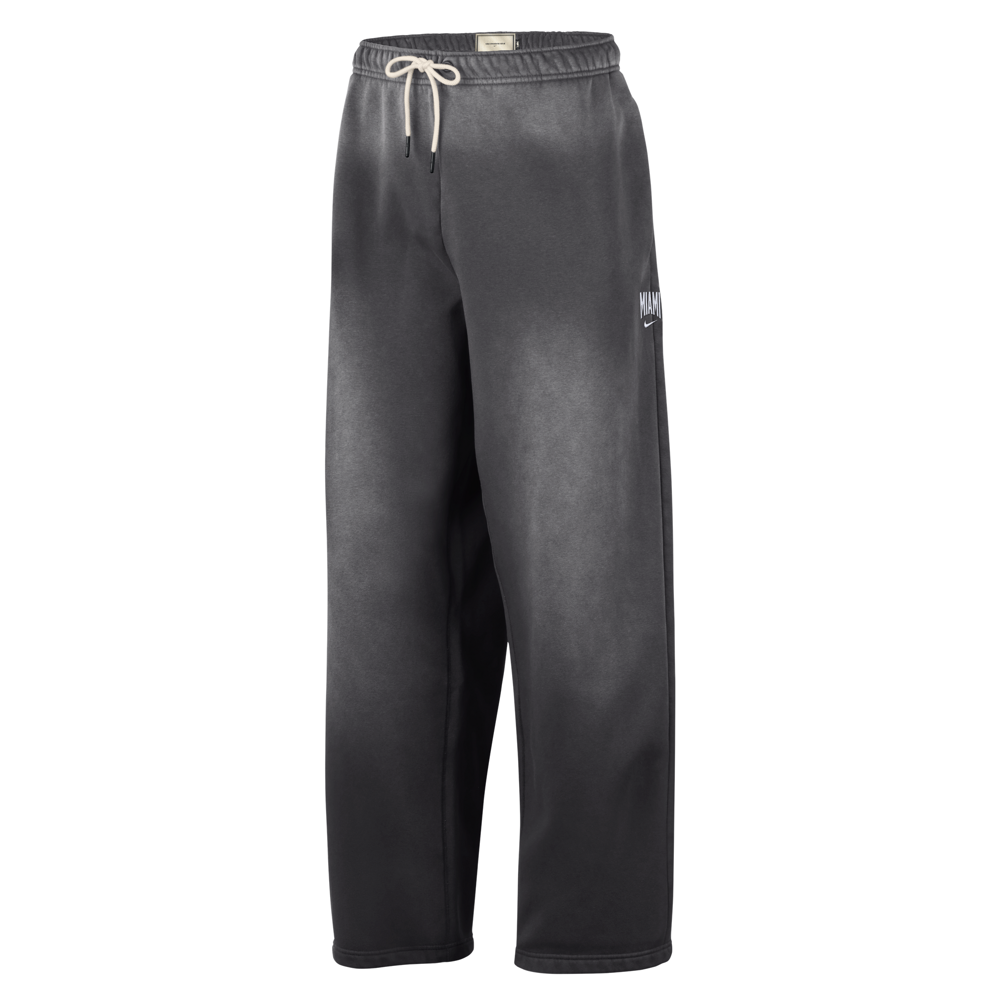 Loose-fitting black Nike Miami HEAT Standard Issue Washed Pants featuring a white drawstring at the waist, subtle fading throughout the fabric, and a small white Nike logo with NOCTA branding on the left thigh, displayed against a plain white background.