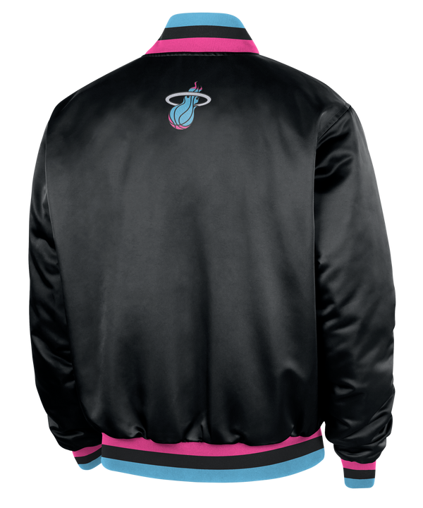 The Nike Miami HEAT Original Vice Nights Bomber Jacket features black satin polyester, “Miami” in blue and pink script on the front, blue and pink trim, NBA logo patch, Nike swoosh sleeve detail, and insulated synthetic fill.
