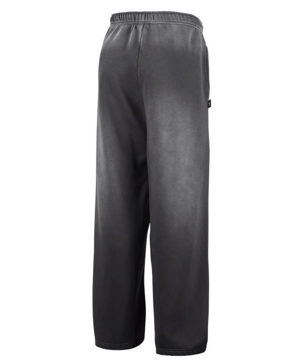 Loose-fitting black Nike Miami HEAT Standard Issue Washed Pants featuring a white drawstring at the waist, subtle fading throughout the fabric, and a small white Nike logo with NOCTA branding on the left thigh, displayed against a plain white background.