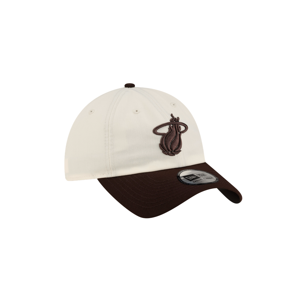 Off-white, one-size-fits-most Court Culture x New Era Café y Leche Dad Cap featuring a brown brim and an embroidered brown Miami Heat logo on the front.