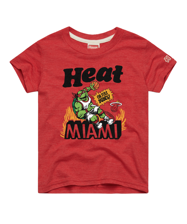 The Homage Miami HEAT Youth Red TMNT Tee by Homage features a cartoon green dragon mascot with sunglasses amid flames, holding a basketball. Made from polyester cotton rayon. “Heat MIAMI” and “Oh dude!” print. Machine wash cold recommended.