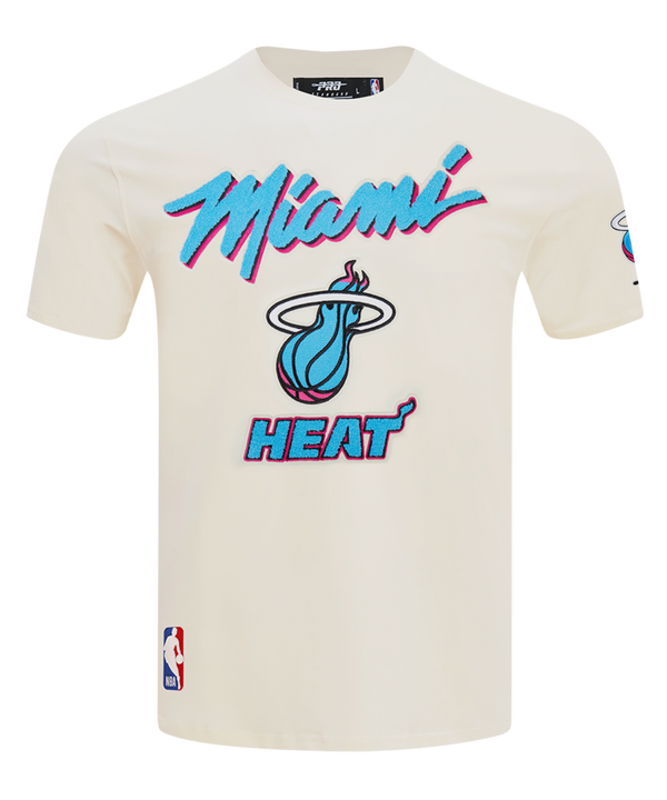 The Pro Standard Miami HEAT Original Vice Nights Logo Tee is a white, standard-fit T-shirt featuring the HEAT logo and name in bold blue and pink on the front, an NBA patch near the hem, and is made from soft cotton spandex that's machine washable.