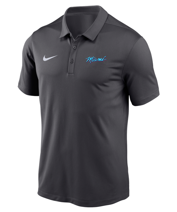 The Nike Miami HEAT Original Vice Nights Polo is a dark gray, short-sleeve polyester shirt with a collar, white Nike logo on the right chest, “Miami” in blue script on the left, three-button placket, standard fit. Wash with like colors.