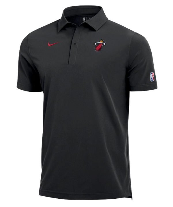 The Nike Miami HEAT Coaches Polo is a black, polyester short-sleeve shirt featuring the Miami Heat logo on the left chest, a red Nike logo on the right chest, and an NBA logo patch on the left sleeve.