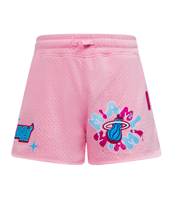 The Pro Standard Miami HEAT Original Vice Nights Girls Graffiti Shorts feature pink polyester mesh, a blue Heat logo with pink splatter on the right leg, a blue and pink comic graphic on the left leg, relaxed fit, and are easy to machine wash.