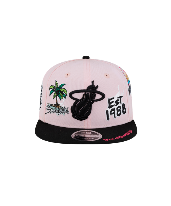 The Court Culture Original Vice Patch Snapback by Court Culture features a light pink and black polyester construction with a slim crown and various embroidered designs, such as palm trees, “EST 1988,” and a stylized logo on the front. Its squared visor is black with pink text on the side.