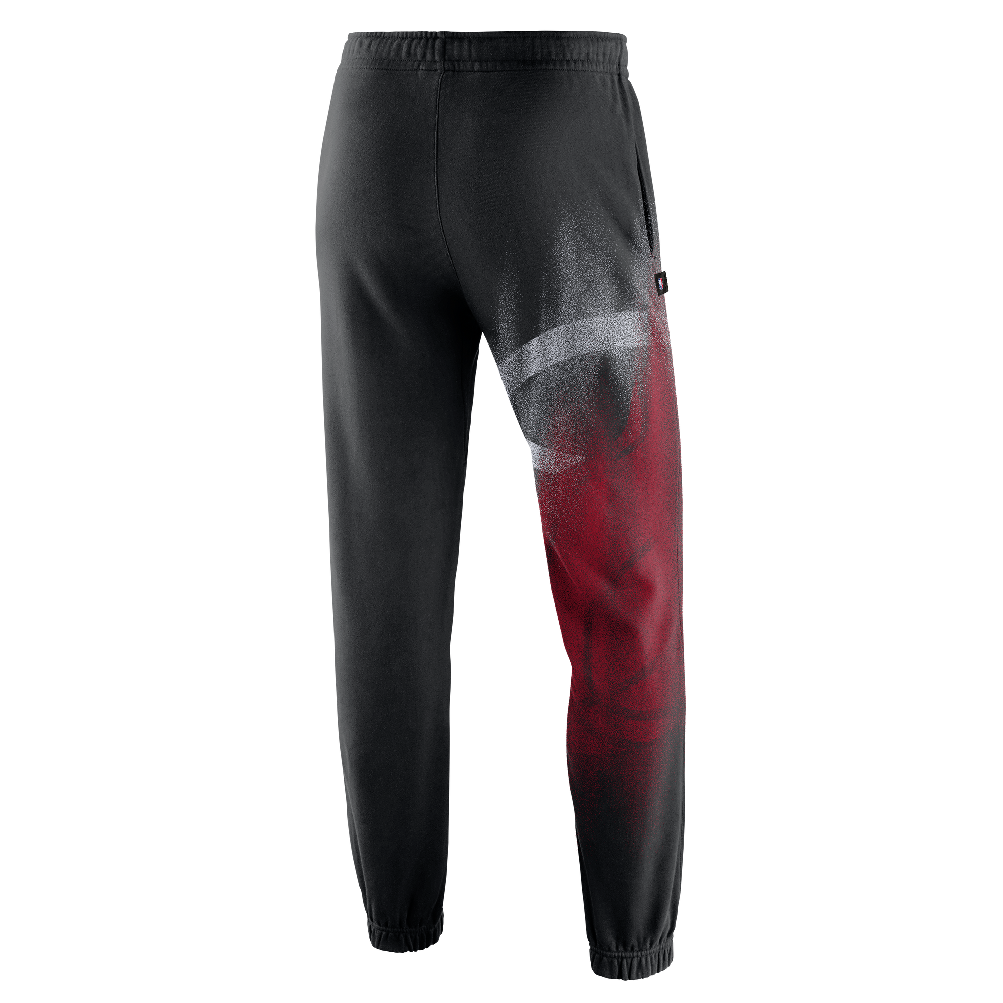 Nike Miami HEAT Standard Issue Oversized Logo Fleece Pants by Nike, shown from the back against a plain white background, feature a loose fit with an elastic waistband and ankles, plus a bold red and white abstract spray paint design on the right leg—perfect for fans of standout style or anyone seeking Miami HEAT fleece pants vibes.