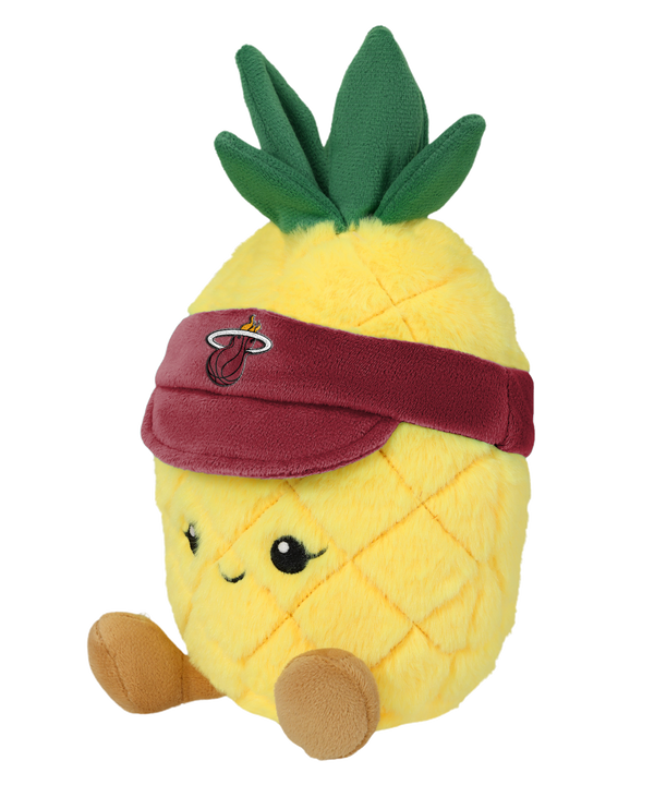 The Miami HEAT Pineapple Plushie by Forever Collectibles features a smiling face, brown legs, and a dark red visor with a flaming basketball logo. Filled with soft polyester fiber, it has green leaves and is surface washable.