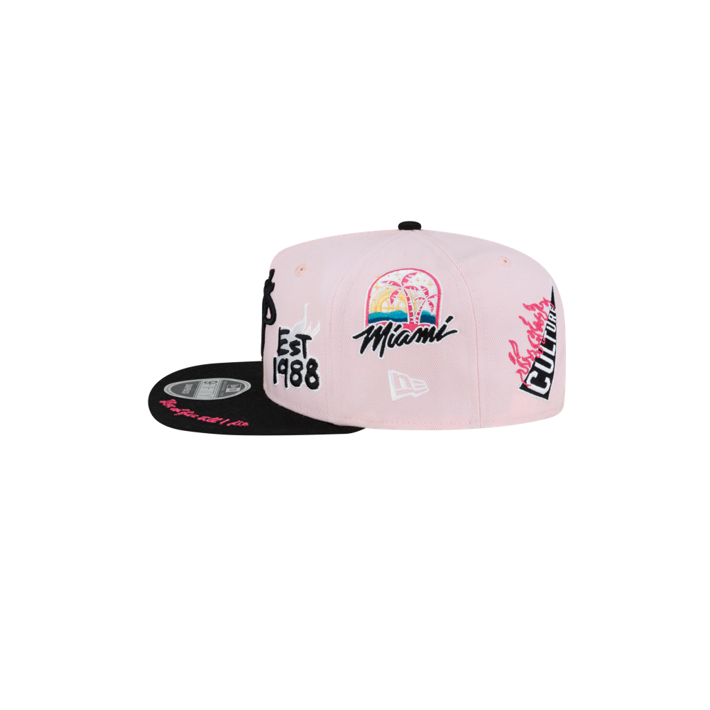 Introducing the Court Culture Original Vice Patch Snapback by Court Culture—a pink snapback hat with a squared visor and slim crown. This stylish polyester cap features vibrant Miami-themed embroidery, including palm trees, “Miami,” “EST 1988,” and other colorful graphic designs on the front, back, and underbrim. Celebrate the lively spirit of Miami with this bold and distinctive accessory.