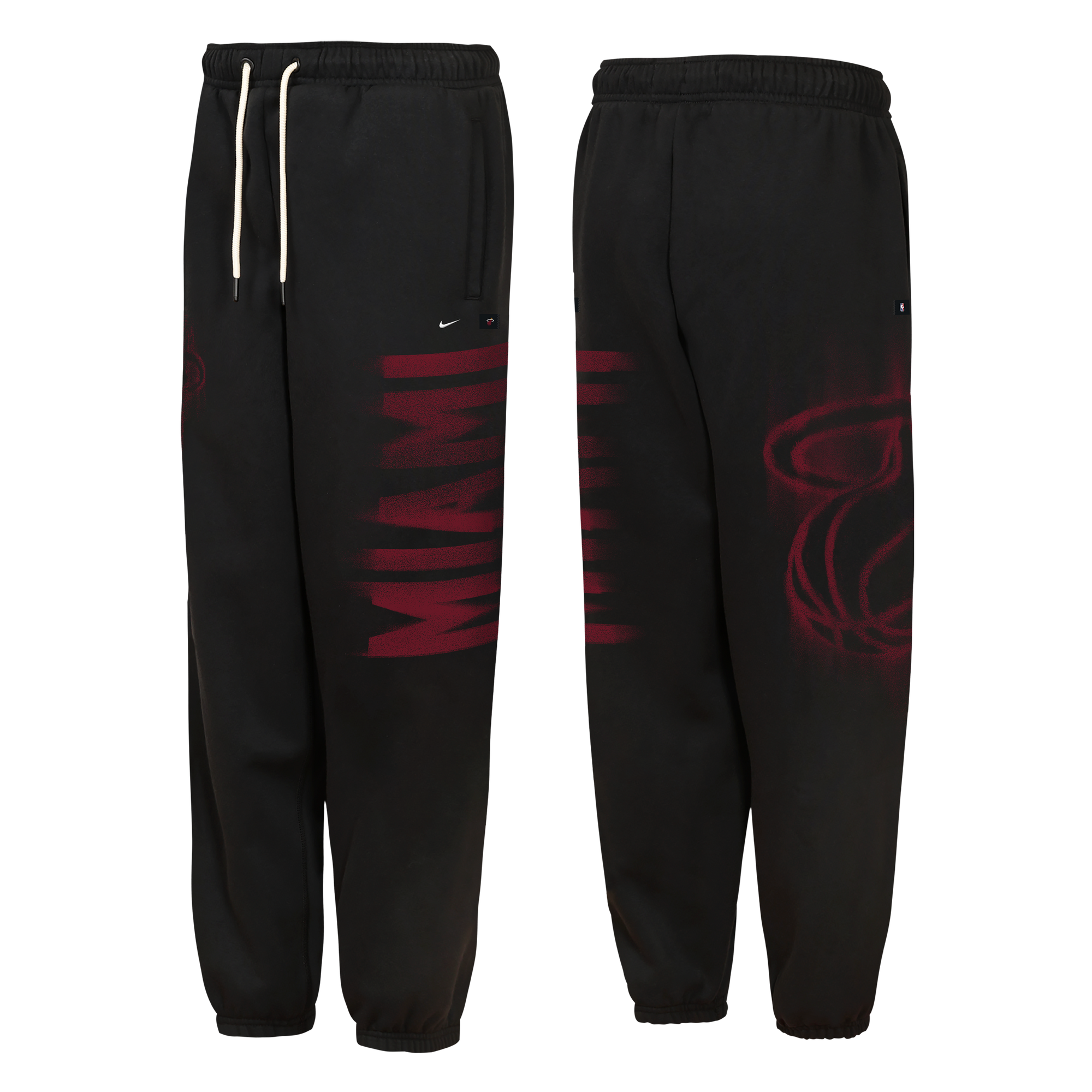 Front and back views of Nike Miami HEAT Wordmark Youth Fleece Pants, featuring standard fit black fleece with a red MIAMI wordmark on the left leg, a red team logo on the right hip, and white drawstrings. Wash inside out.