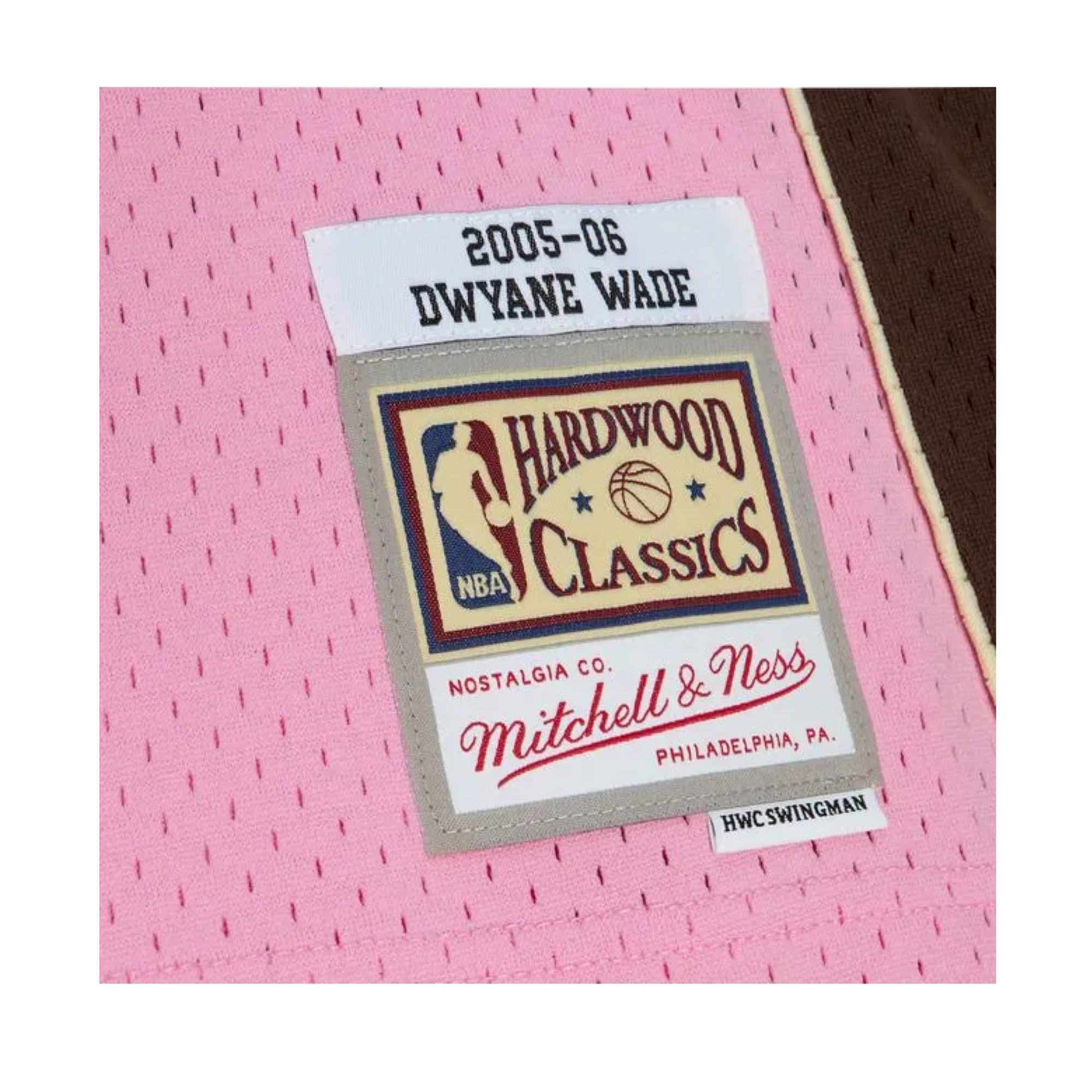 Pink Miami HEAT 2005-06 Dwyane Wade Hardwood Classics swingman jersey tag close-up. - Dwyane Wade Mitchell & Ness Miami HEAT 2005-06 Pink Bacon Jersey