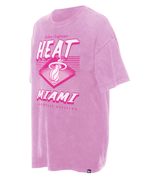 The New Era Miami HEAT Women's Pink Washed Tee features a vintage-style oversized fit with white and pink Heat logo, Eastern Conference, HEAT MIAMI, and Southeast Division text on the front. 100% cotton; machine wash cold.