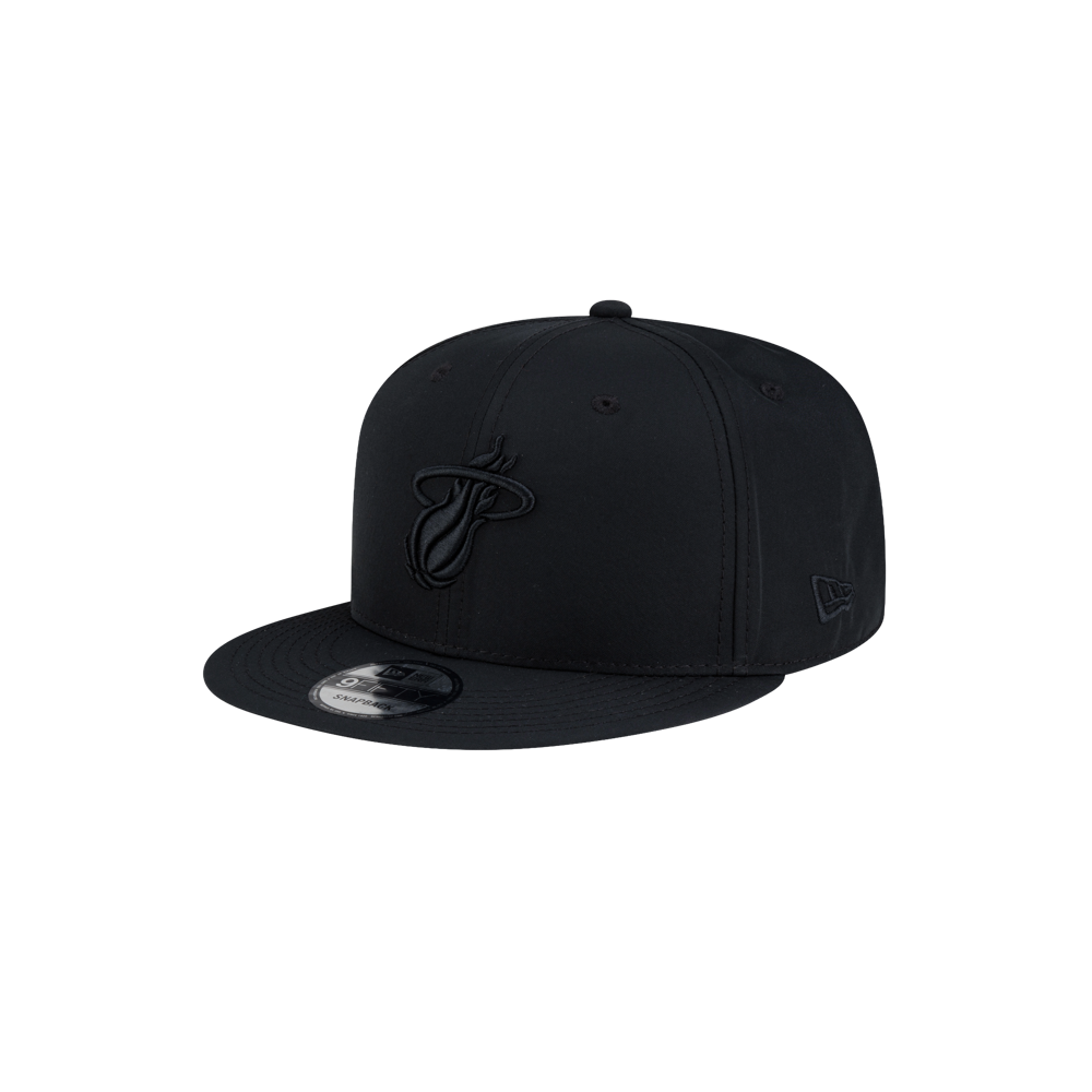 Court Culture x New Era Blackout snapback hat in black polyester with a tonal Miami Heat logo embroidered on the front.