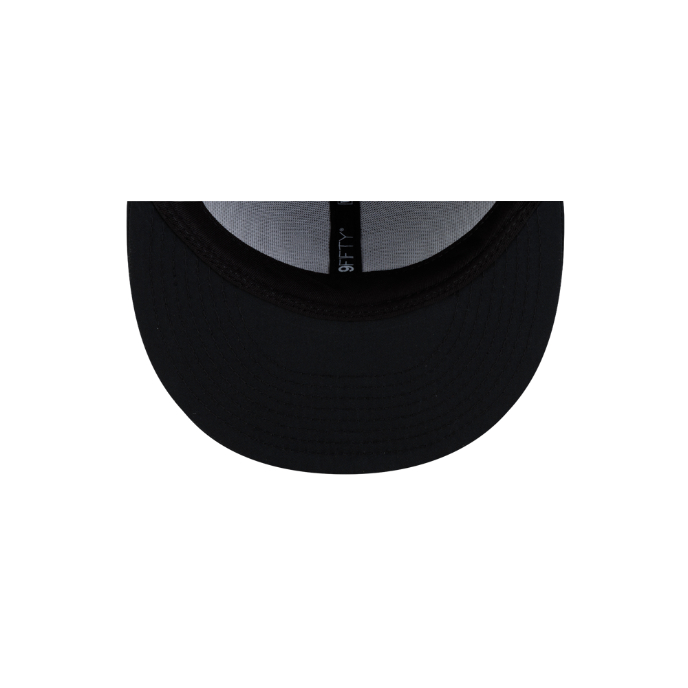 Top-down view of the black polyester brim of a Court Culture x New Era Blackout Snapback.