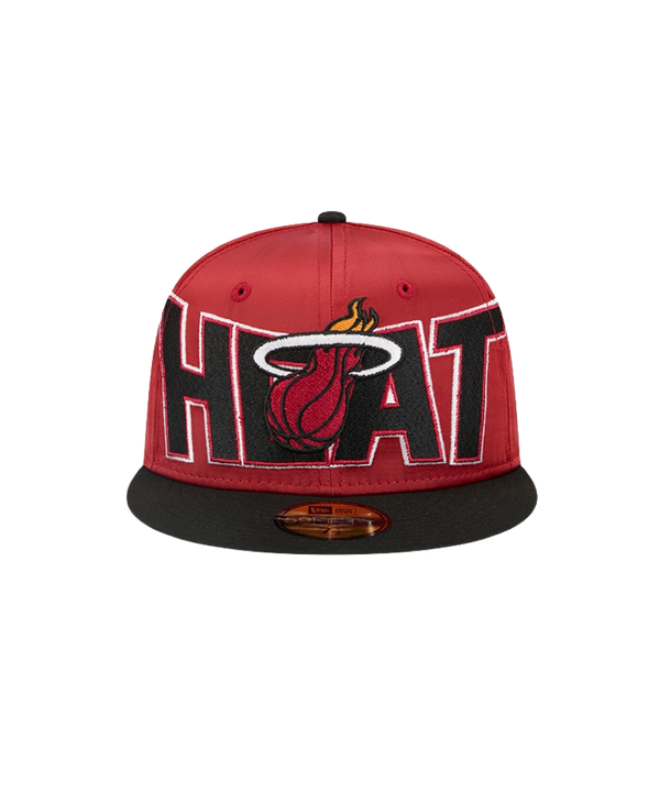The New Era Miami HEAT Red Satin Fitted Hat features bold HEAT lettering and the flaming basketball logo on the front, a comfortable spandex visor, and an easy-to-clean polyester design.