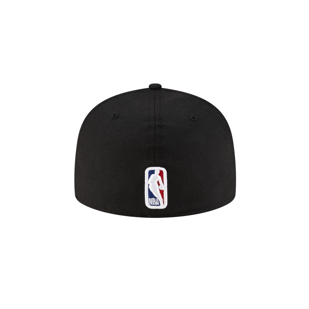 The New Era Miami HEAT 06' Ring Fitted Hat is a black wool baseball cap with a fitted design, featuring the NBA logo in red, white, and blue at the back center. For best care, spot clean. The background is plain and light-colored.
